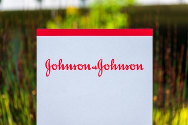 Johnson and Johnson sign, logo at an American multinational corporation office. The company develops medical devices, pharmaceuticals, and consumer packaged goods. - San Jose, California, USA - 2021