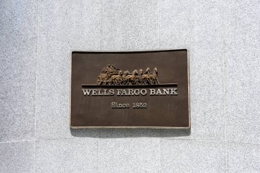 Wells Fargo Bank stagecoach plaque at bank headquarters - San Francisco, California, USA - 2021