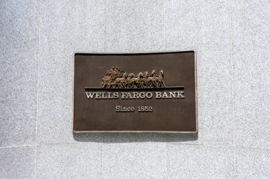 Wells Fargo Bank stagecoach plaque at bank headquarters - San Francisco, California, USA - 2021 clipart