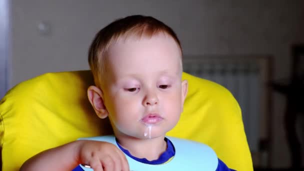 Little Boy Sitting High Chair Eating Milk Soup Making Funny — Wideo stockowe