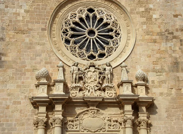 stock image details of Romanesque architecture on the facade of the Cathedral of Santa Maria Annunziata.