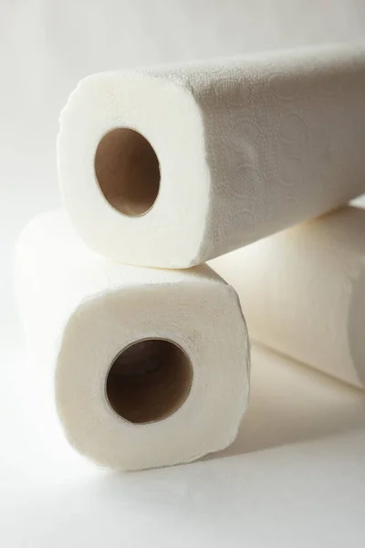 rolls of paper towels, napkins on a white background. White on white, pulp, paper, hygiene. The concept of conscious consumption, sustainable lifestyle.