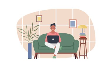 Evde dizüstü bilgisayarla çalışan genç bir adam. Çevrimiçi eğitim, uzaklık öğrenimi