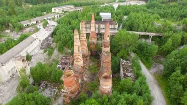 Ruins of old factory with high chimney — Stock Video