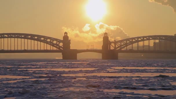 Road bridge over the frozen river in winter. — Stock Video