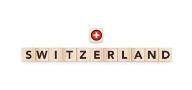 İsviçre bayrağı ve adını taşıyan tahta bloklar. Bir kopya alanı tasarımında İsviçre ve Avrupa Kültürü, ulusal kimlik, seyahat ve coğrafya.