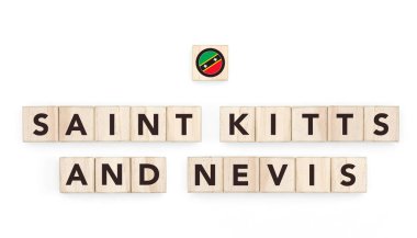 Aziz Kitts ve Nevis 'in bayrağını taşıyan tahta bloklar. Bir kopya uzay tasarımında Nevisian ve Karayip Kültürü, ulusal kimlik, seyahat ve coğrafya.