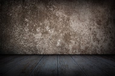 Eski beton duvar ve ahşap zemin.