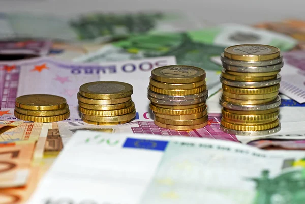 Euro banknotes and coins — Stock Photo, Image