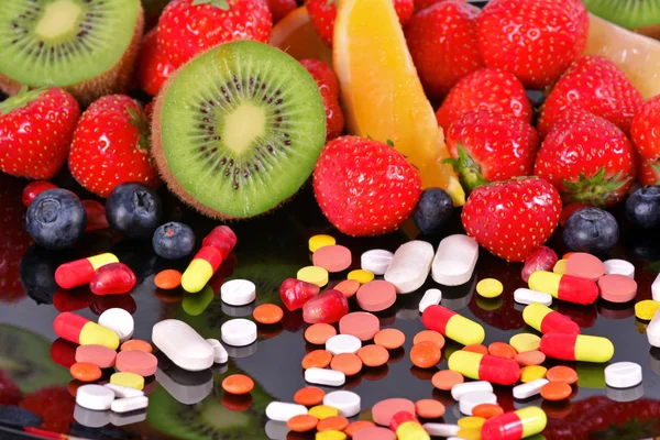 Beeren, Früchte, Vitamine und Nahrungsergänzungsmittel Stockbild