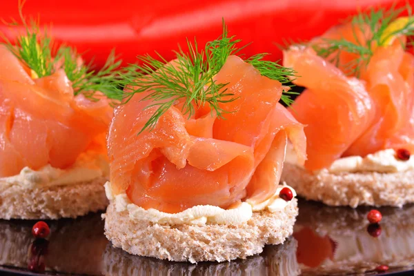 Holiday appetizer with salmon canapes — Stock Photo, Image