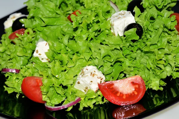 Salad with tomatoes, olives and feta cheese — Stock Photo, Image