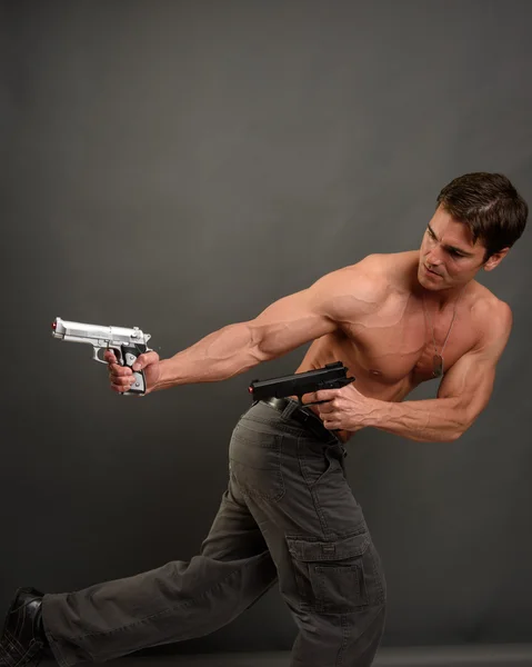 Tough warrior with gun — Stock Photo, Image