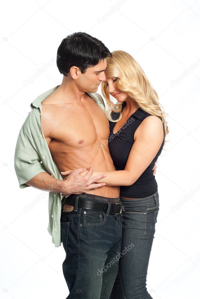 The sexy couple share a loving embrace together. 