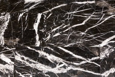 Beyaz damarlı siyah mermer fayans. Mermer zemin, taş desenleri uyumlu..