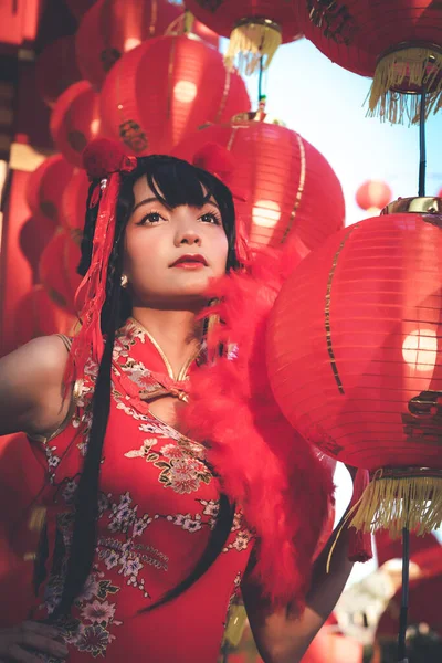 Lady in red costume in Chinese new year festival, looking forward for emotion portrait