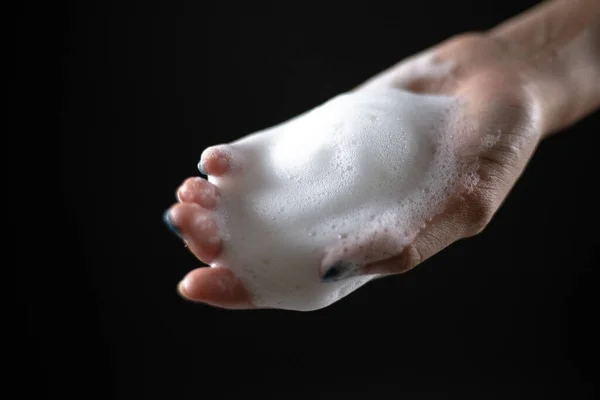 Woman Hand Soft White Foam Hand Light Shining Black Background — Stock Photo, Image