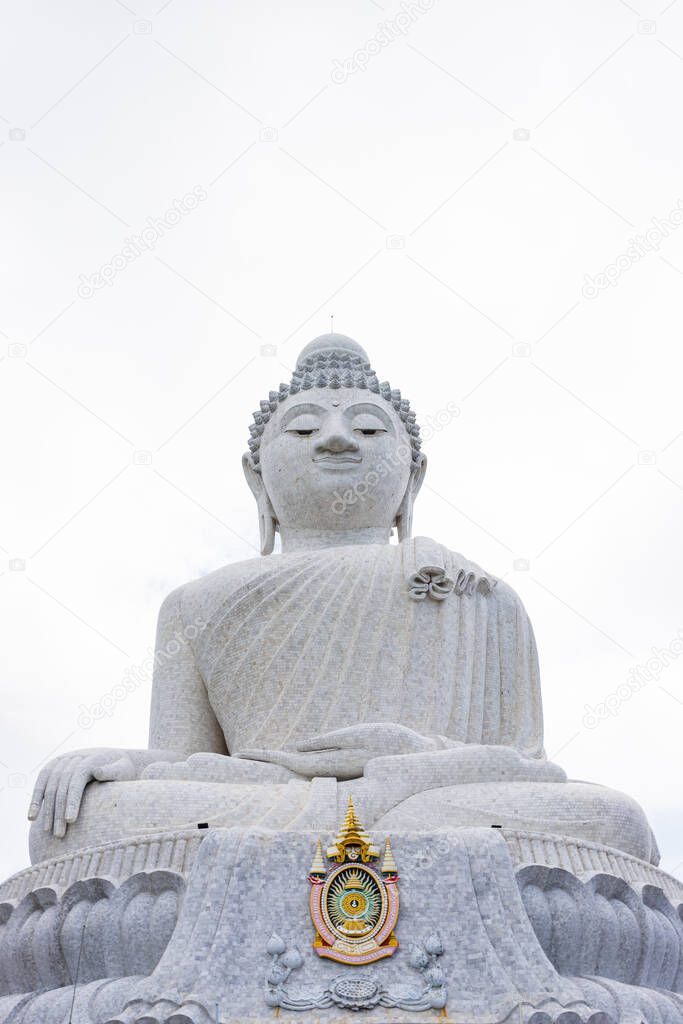White big buddha with white sky of cloudy, have Thai King symbol