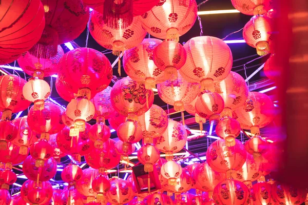 many chinese lanterns hang on the top ceiling made with rope at night, Chinese character mean wish you have a lot of lucky