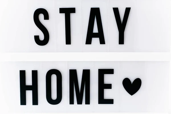 Lightbox with text STAY HOME, close up . Stay safe, stay inside home concept — Stock Photo, Image