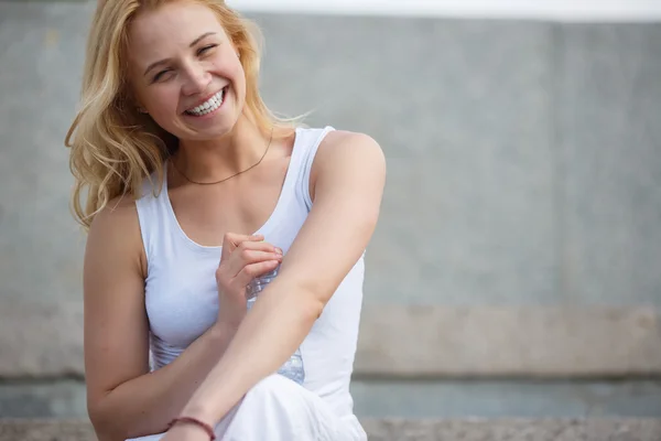 Pretty blonde laughing at camera