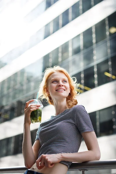 Portrait on urban background of slim hipster girl with mojito Stock Photo