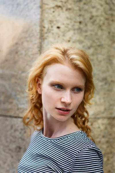 Portrait of curly red-haired young woman with blue eyes — Stock Photo, Image