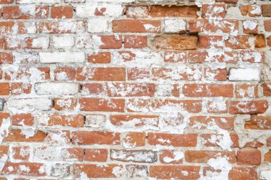 Arka plan, beyaz alçılı eski kırmızı tuğla bir duvarın dokusu.