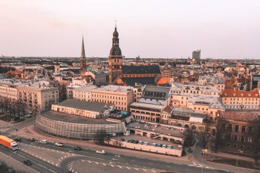 RIga rooftop view panorama at sunset with urban architectures and Daugava River.