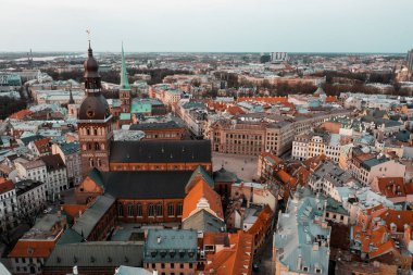 RIga rooftop view panorama at sunset with urban architectures and Daugava River.