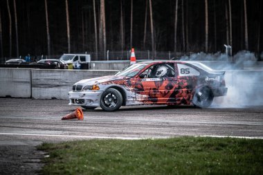 01-05-2021 Riga Latvia. car drifting with smoke, motion blur drift.
