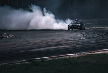 01-05-2021 Riga Latvia. car drifting with smoke, motion blur drift.