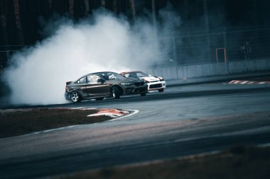 01-05-2021 Riga Latvia. car drifting with smoke, motion blur drift.