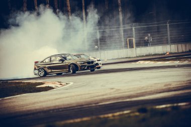 01-05-2021 Riga Latvia. car drifting with smoke, motion blur drift.