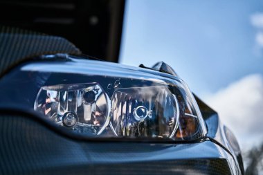 Modern headlight on a old BMW car.