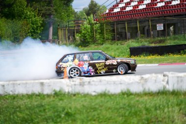 22-1-05-2021 Riga, Latvia. Power drifting car from side.