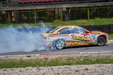 22-1-05-2021 Riga, Latvia. Power drifting car from side.