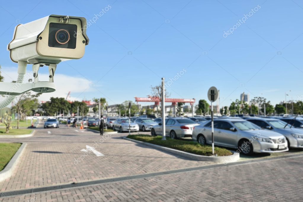 CCTV Camera or surveillance operating on garage Stock Photo by