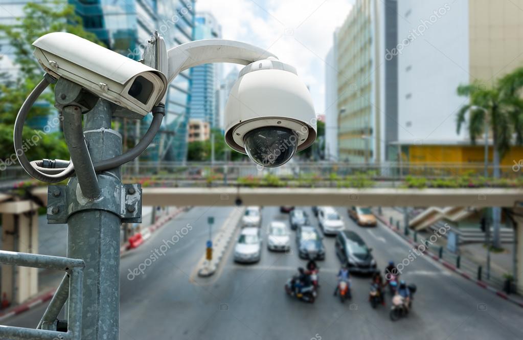 CCTV camera or surveillance operating on traffic road — Stock