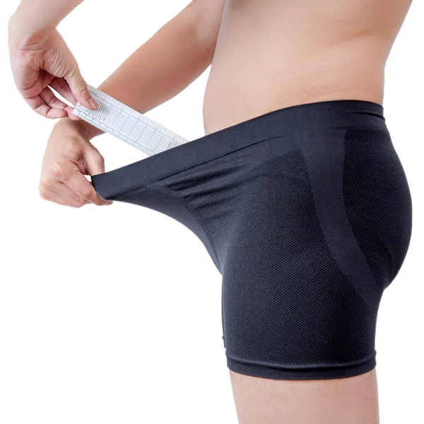 Close up of man on black boxer underware using ruler measure penis — Stock Photo, Image