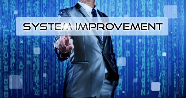 Business man with digital background pressing on button system improvement — Stock Photo, Image