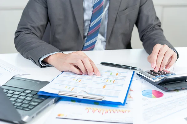 Businessman using calculator analyze report — Stock Photo, Image