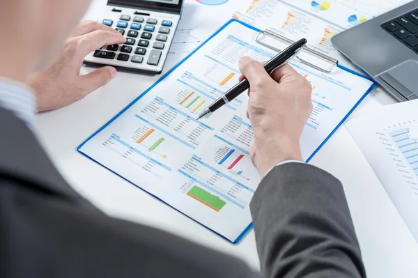 Businessman using calculator analyze report — Stock Photo, Image