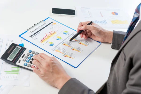 Businessman analyzing report, business performance concept — Stock Photo, Image
