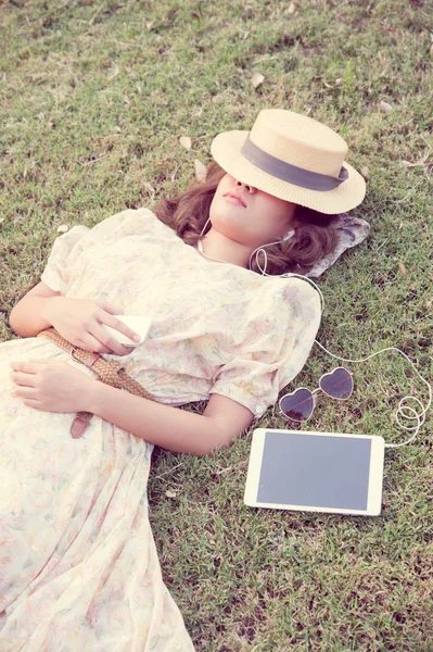 Vintage Girl sleep in park listen music via small talk — Stock Photo, Image