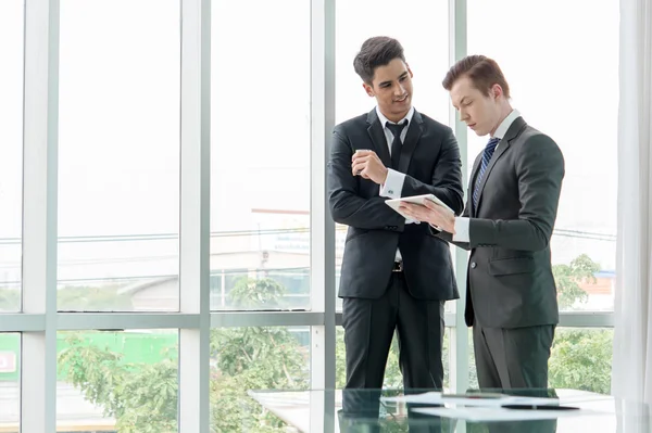 Business partners discussing documents and ideas in office — Stock Photo, Image