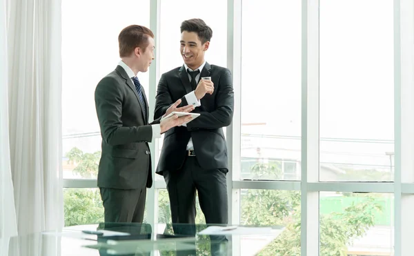 Business partners discussing documents and ideas in office — Stock Photo, Image