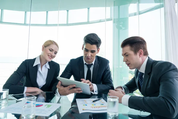 stock image business partners discussing documents and ideas at meeting