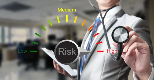 Business man with stethoscope, risk management concept — Stock Photo, Image