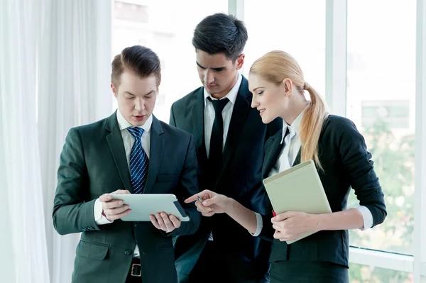 Business partners discussing documents and ideas at meeting — Stock Photo, Image